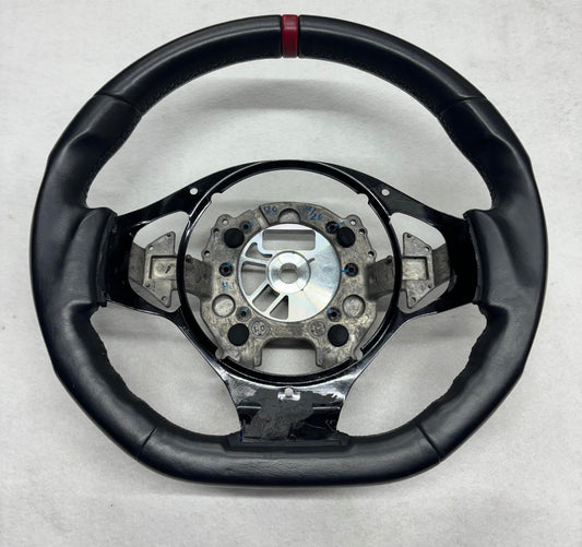 A132V0378F Evora Steering Wheel Black Leather With Red Stripe